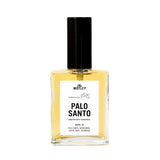 The Motley Palo Santo Fragrance in a glass bottle with gold liquid and a black pump cap against a white background.