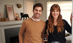 Brother and sister Matt and Madison are the cofounders of The Motley brands, and they stand side by side smiling at the camera in a living room.