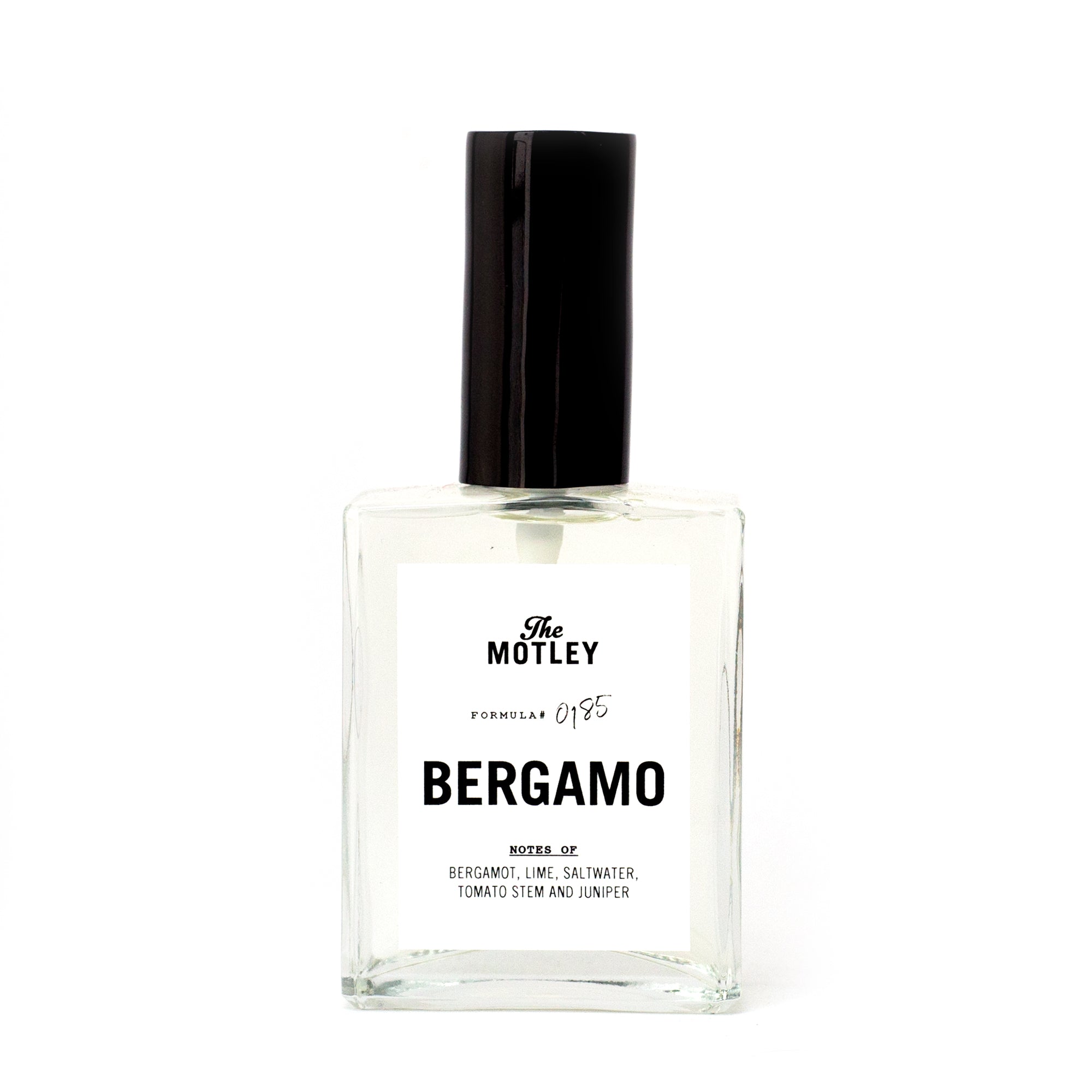 The Motley Bergamo Fragrance in a glass bottle with clear liquid and a black pump cap against a white background