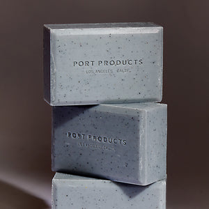 three Sand Bar soaps stacked on top of each other on a dark gray background