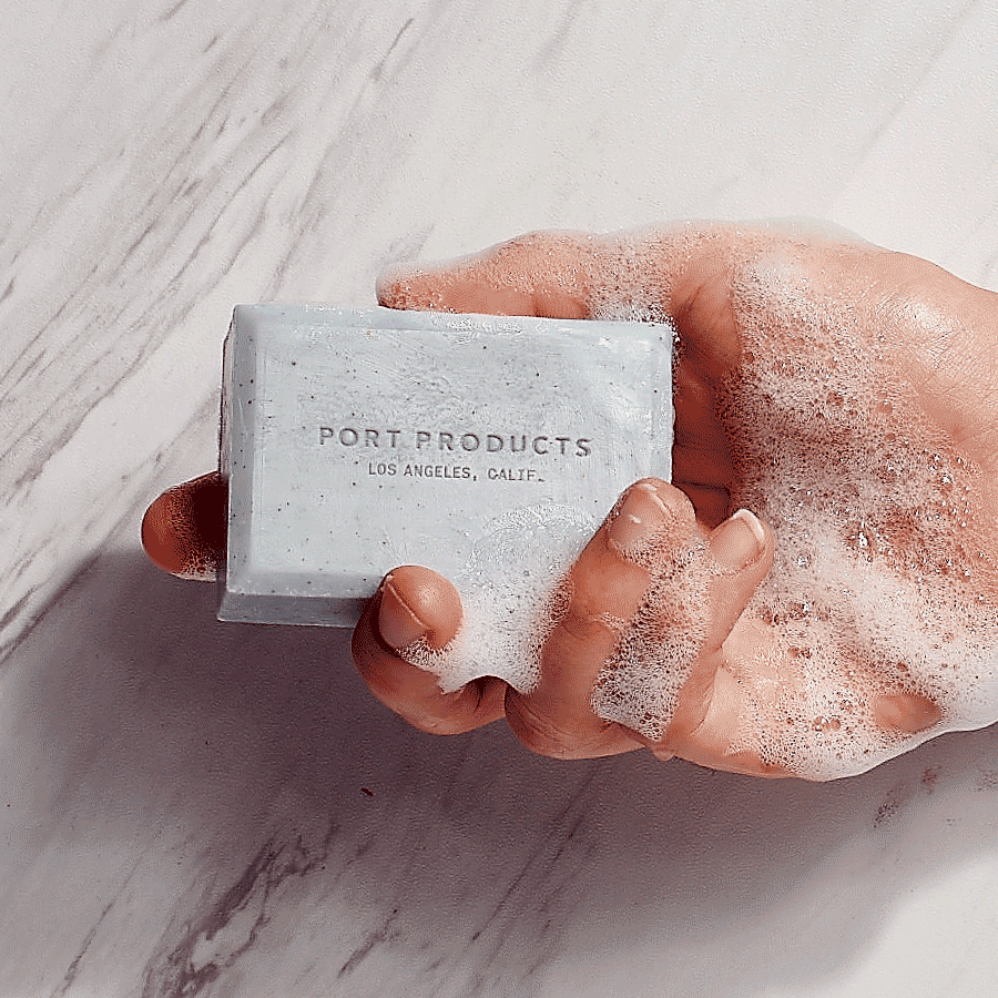 gif of gray Sand Bar soap bar in hand with soap suds