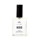 The Motley Kiso Fragrance in a glass bottle with clear liquid and a black pump cap against a white background.