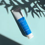 Port Products Balancing Daily Moisturizer tube on blue background with shadow